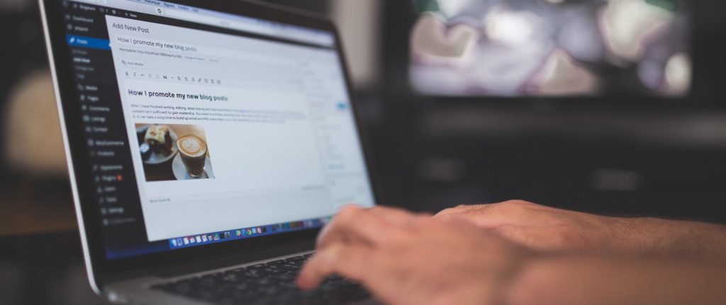 Web designer creating a professional WordPress website on laptop